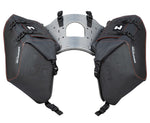Black motorcycle side bags with a central mounting plate on a white background